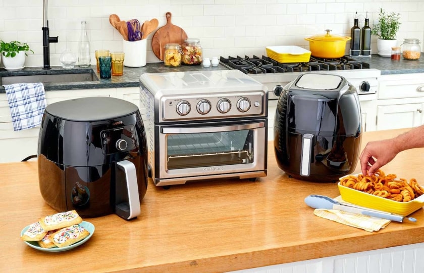 Modern kitchen counter featuring an air fryer and toaster oven, key appliances to know in Spanish for kitchen-related conversations.