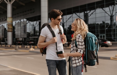 A happy couple ready for their trip to Spain, indicating familiarity with Spanish phrases.