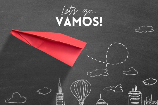 A red paper airplane soars from a classroom blackboard with 'Let's Go' and 'VAMOS!', embodying limitless imagination and the excitement of new adventures